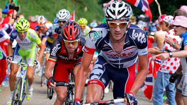 Allies in motion ... Jurgen Van Den Broeck (R) of Belgium, Cadel Evans (C) of Australia and Vincenzo Nibali (L) attacks yellow jersey wearer Bradley Wiggins of Great Britain.