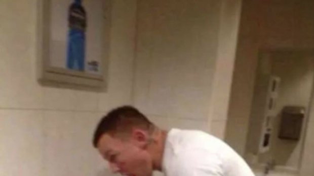 Stupidity personified: The infamous image that caused a social media storm. Todd Carney was snapped at a urinal creating a 'fountain'.