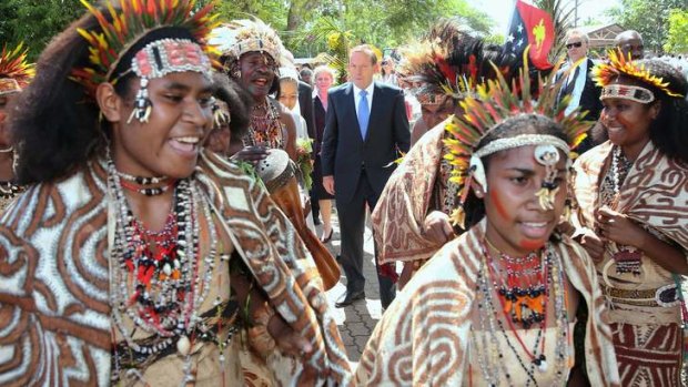Establishing connections: Prime Minister Tony Abbott officially opens Australian aid-funded facilities at Caritas Technical School in Port Moresby during his trip to Papua New Guinea.