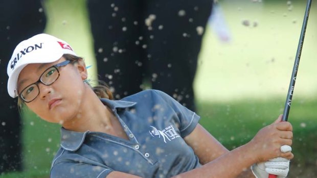 Teen star &#8230; amateur Lydia Ko blasts out of the bunker on the 14th hole yesterday on her way to a stunning win in the Women's NSW Open at Oatlands. The 14 year-old became the youngest player - male or female - to win a professional tournament.