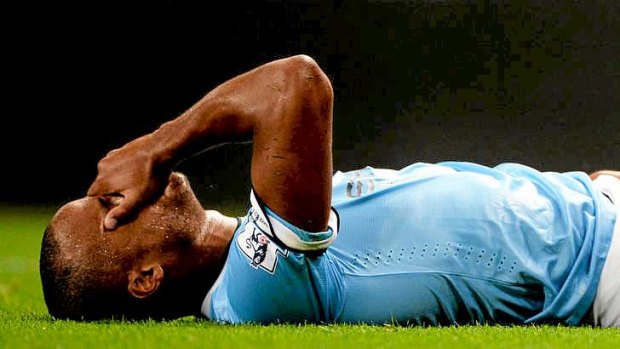 Sidelined: Manchester City skipper Vincent Kompany could miss the crucial clash with Manchester United.