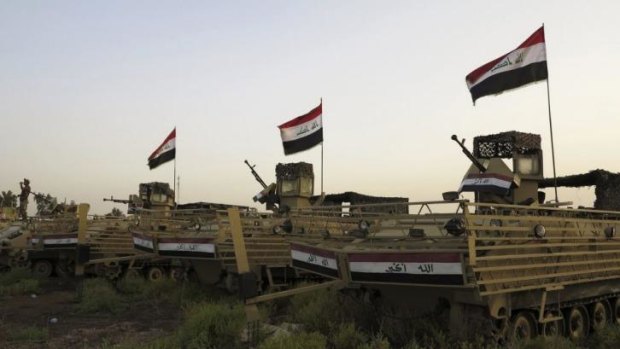 Iraqi military vehicles  on the outskirts of the city of Samarra.