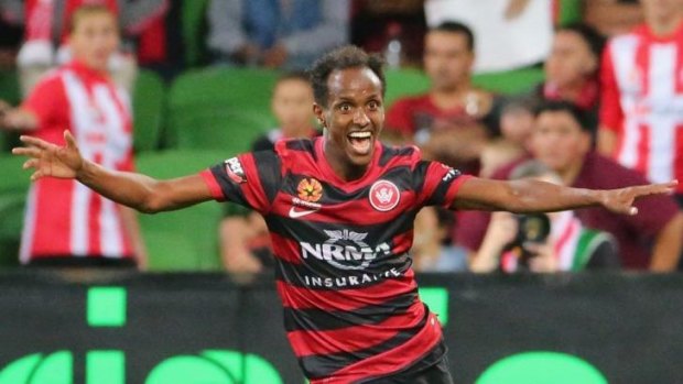 Youssouf Hersi celebrates after scoring the match-winning goal for the Wanderers against Melbourne Heart at AAMI Park.