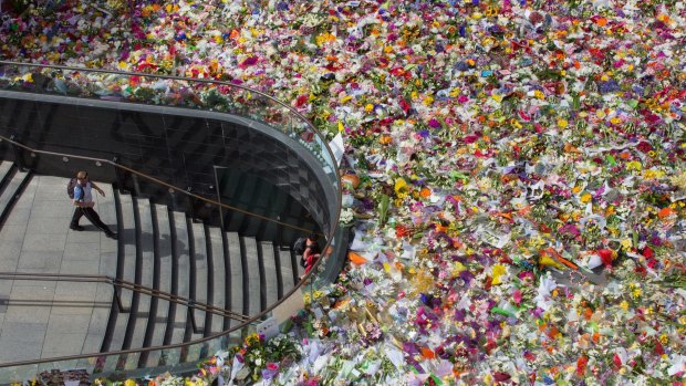 Thousands of floral tributes were placed in Martin Place for victims Tori Johnson and Katrina Dawson