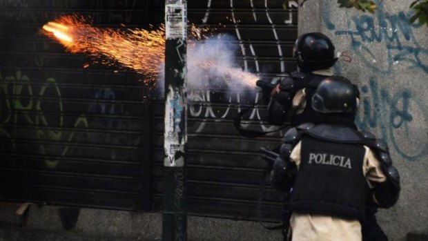 Riot policemen shoot tear gas during a protest against Venezuelan President Nicolas Maduro.