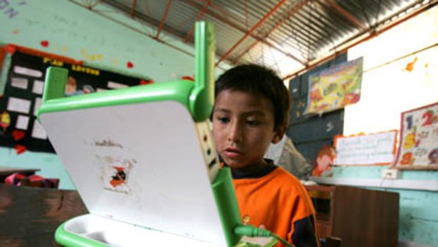Renzo reads on his "XO" laptop in Arahuay, an Andean hilltop village in Peru.