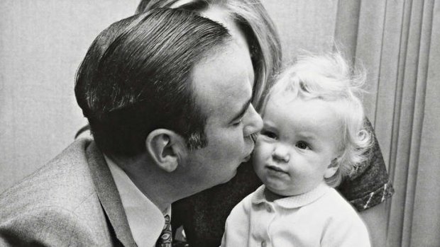 Heir to the throne? … Rupert Murdoch with his then 14-month-old daughter Elisabeth and second wife Anna (obscured), in London in 1969.