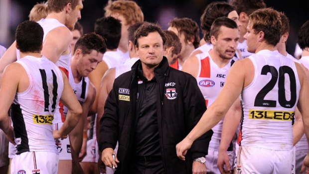 Black sheep: Scott Watters is surrounded by St Kilda players during game in July.