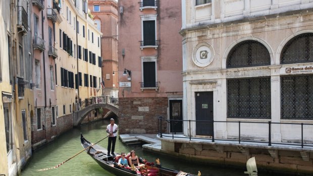 Tourists enjoying a gondola ride in Venice after lockdowns ease.