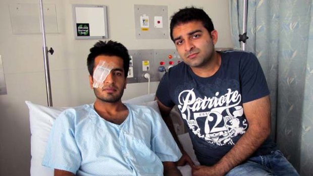 Ali Arshad, 24, pictured with friend Umer Maqbool, may lose sight in one eye after the attack.