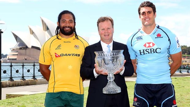 Top prize &#8230; Tatafu Polota-Nau, left, and Dave Dennis flank ARU chief executive Bill Pulver with the Tom Richards Trophy that is up for grabs when the British and  Irish Lions tour this year.