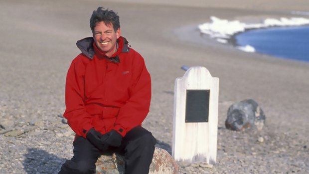 Author John Geiger, at the grave of polar explorer John Torrington, on Beechey Island, North-west Territories, in Canada.