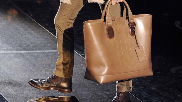 Most men these days can't function without an over-the-shoulder or clutch bag.