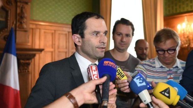 French Education Minister Benoit Hamon addresses reporters at the prefecture of the Tarn region in Albi, southwestern France, about the investigation into the stabbing murder.