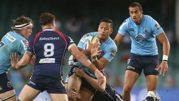 Strike weapon: Israel Folau takes on the Melbourne Rebels' defence on Friday.