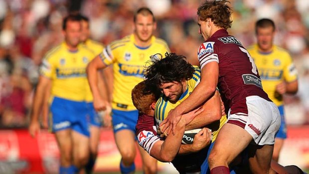 Nathan Hindmarsh of the Eels is tackled.