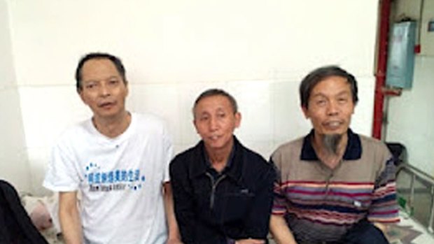 Leading dissident Li Wangyang (left) posing with his friends in Shaoyang, in central China's Hunan province.