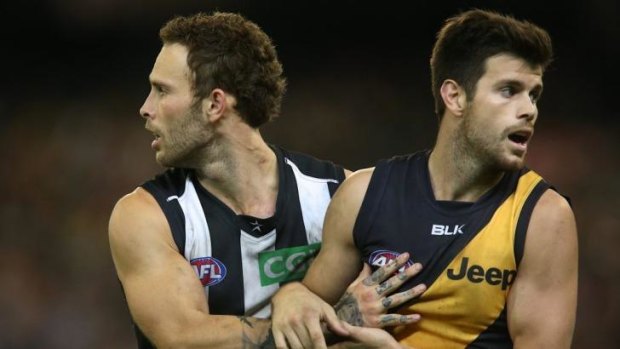 Brent Macaffer and Trent Cotchin tussle at the MCG on Friday night