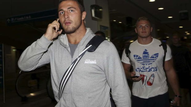 Rabbit in the spotlight: South Sydney forward Sam Burgess returned to Sydney on Monday night with brothers and Bunnies teammates, George, Thomas and Luke.