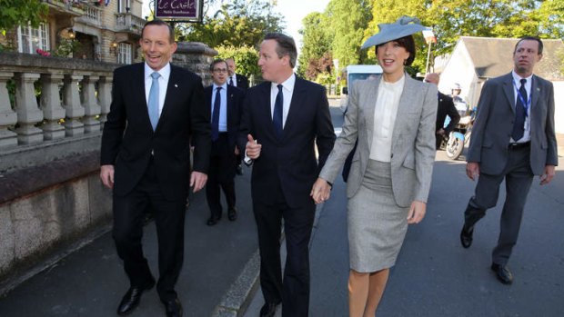 Prime Minister Tony Abbott arrived with UK Prime Minister David Cameron and his wife Samantha at the Bayeux Cathedral for a D-Day service in France.