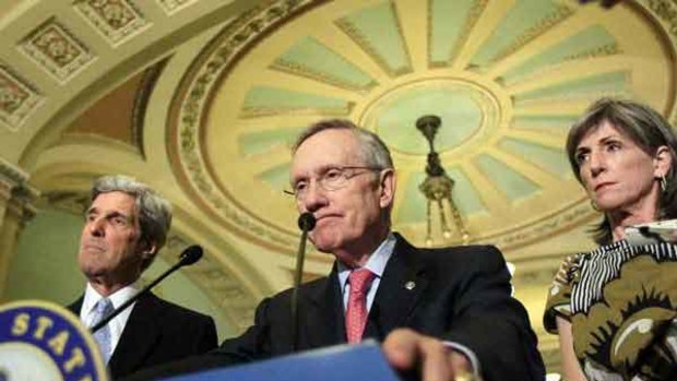Senate majority leader Harry Reid, centre, with Sen. John Kerry, left, and Director of the White House office of Energy and Climate Change Policy, Carol Browner. <i>Picture: AP/Alex Brandon</i>