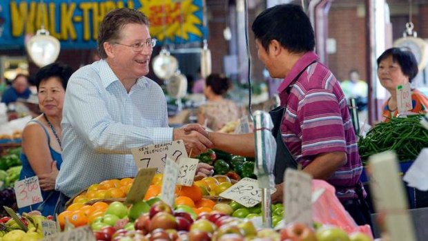 New Victorian Premier Denis Napthine meets a stall operator at the market.