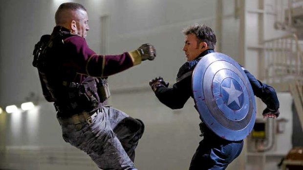 Box office smash ... George St-Pierre, left, and Chris Evans in a scene from <i>Captain America: The Winter Soldier</i>.