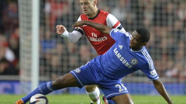 Arsenal's Jack Wilshere (L) challenges Chelsea's Samuel Eto'o at the Emirates.