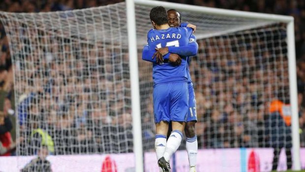Magnificant eight ... Eden Hazard of Chelsea is congratulated by Victor Moses after scoring his team's seventh goal.
