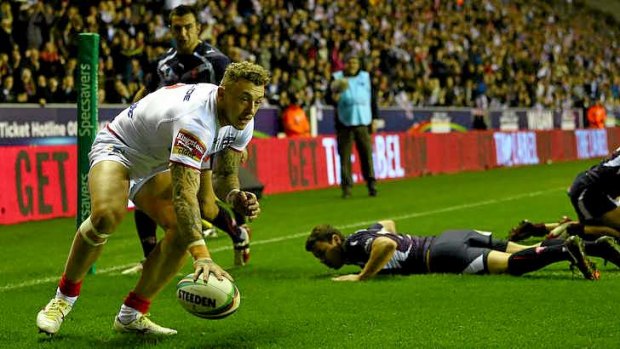 Joshua Charnley of England scores his second try.
