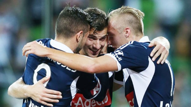 In front: Victory's James Troisi (centre) celebrates his penalty goal with James Jeggo (right) and Kostas Barbarouses.