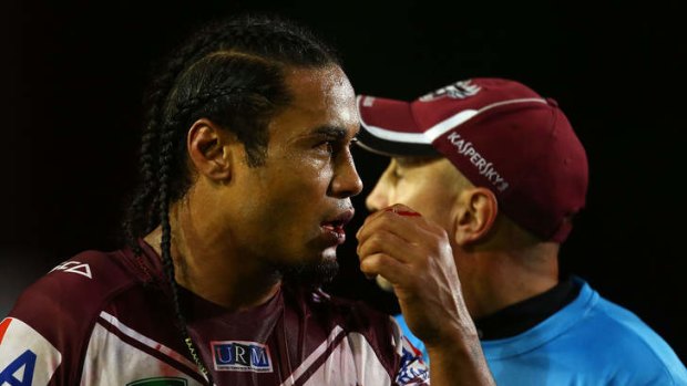 Fire and brimstone: Manly centre Steve Matai nurses a bleeding lip after being punched by Parramatta prop Mitchell Allgood.