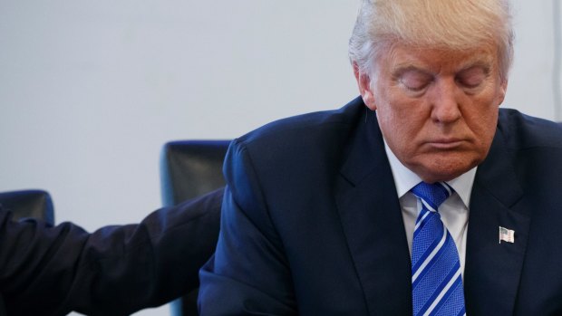 Donald Trump pauses during a meeting with members of the National Border Patrol Council at Trump Tower, on Friday.