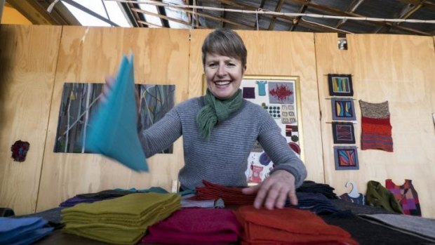 Sewer: Gaye Naismith separates woollen patches at her studio.