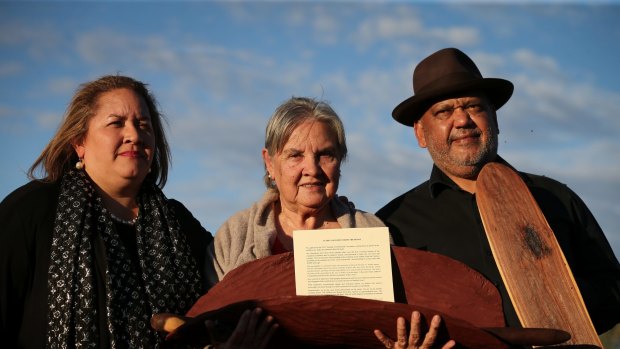 Megan Davis, Pat Anderson from the Referendum Council holding the Uluru Statement from the Heart, and Noel Pearson.