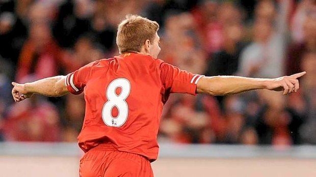 Goal: Liverpool skipper Steven Gerrard wheels away in celebration after sending a packed MCG into raptures with the opening goal against Melbourne Victory.