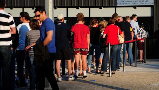 Fans line up to get into Canberra Stadium on Saturday night following a ticket bungle by the Brumbies.