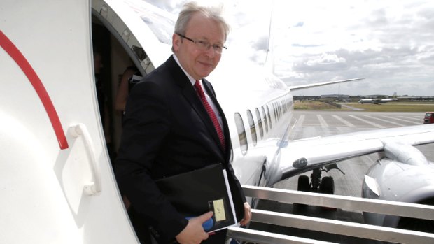 Zipping around: Kevin Rudd steps off his jet for another day of campaigning in Brisbane on Monday.