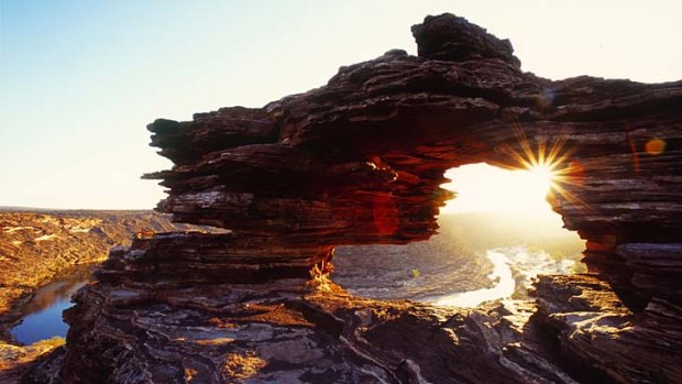 Rock stars ... sunset over the dramatic Nature's Window formation in the Kalbarri National Park.