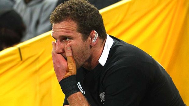 Fearing the worst ... Kieran Read of the All Blacks sits injured on the bench against Australia.
