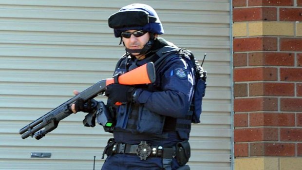 Heavily armed police at the scene of a siege in Black Hill, near Ballarat.