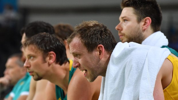 Thrashed: the Australian players look on from the bench.