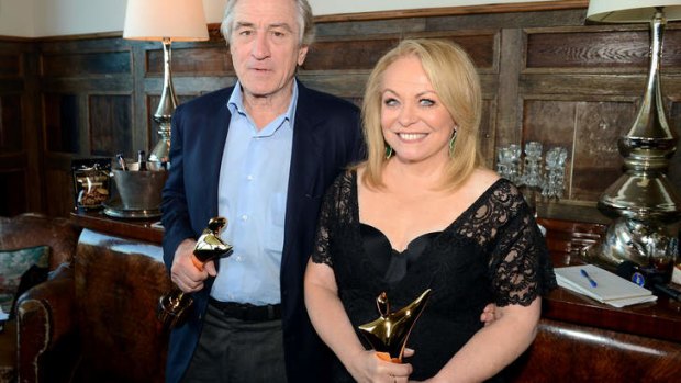 Robert De Niro and Jacki Weaver clutching their Australian Academy of Cinema and Television Arts awards.