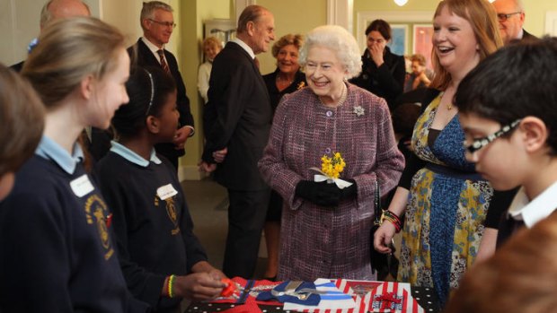 The Queen meets schoolchildren at the Kensington Palace reopening.