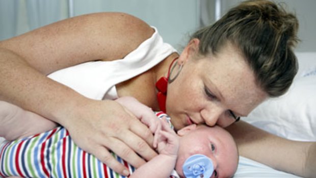 Coochie-coochie-coorious ... Victoria Trenouth, pictured with her son George, experienced absent-mindedness, but new findings contradict so-called baby brain.