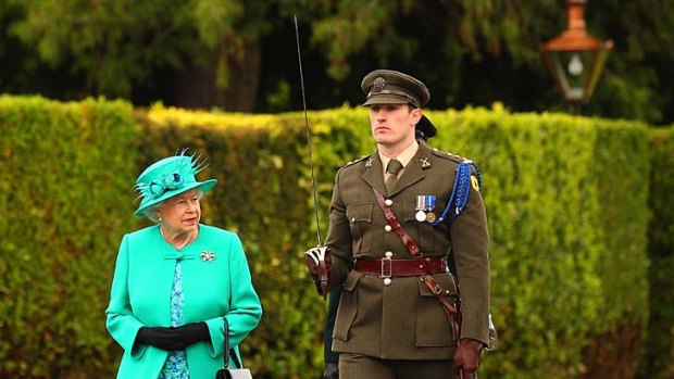 Queen Elizabeth II inspects the Guard of Honour at the Aras an Uachtarain, the official residence of the President of Ireland.