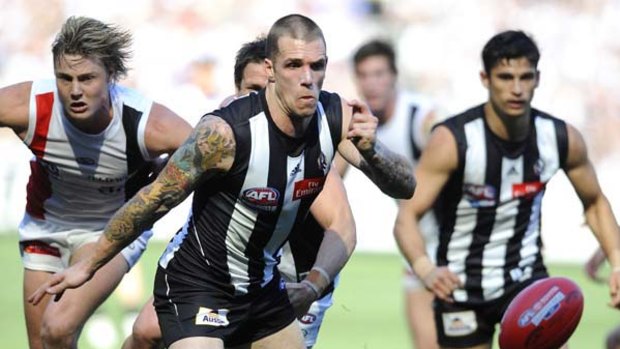 Dane Swan has eyes only for the footy.