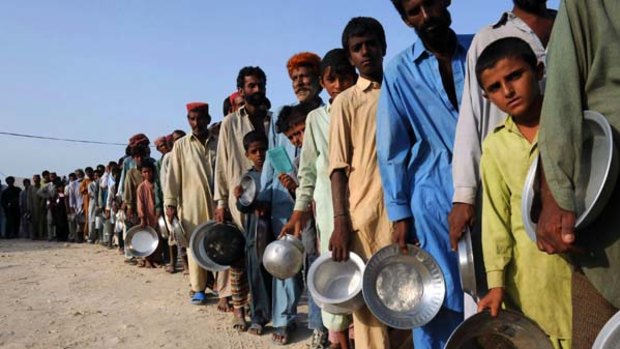 Waiting for food in flood-hit Pakistan.