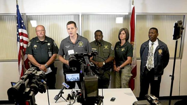Sheriff Robert Schultz, second from left, at a news conference after the Bell shooting.