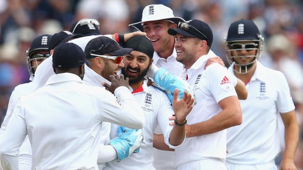 Monty Panesar celebrates after taking the wicket of Steve Smith.